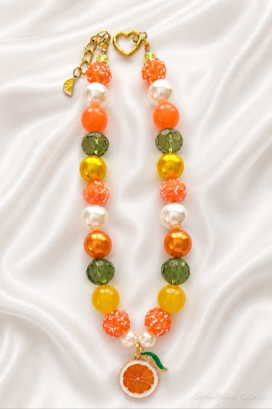 Orange Blossom Heiress statement necklace with orange, gold, olive green and pearl beads