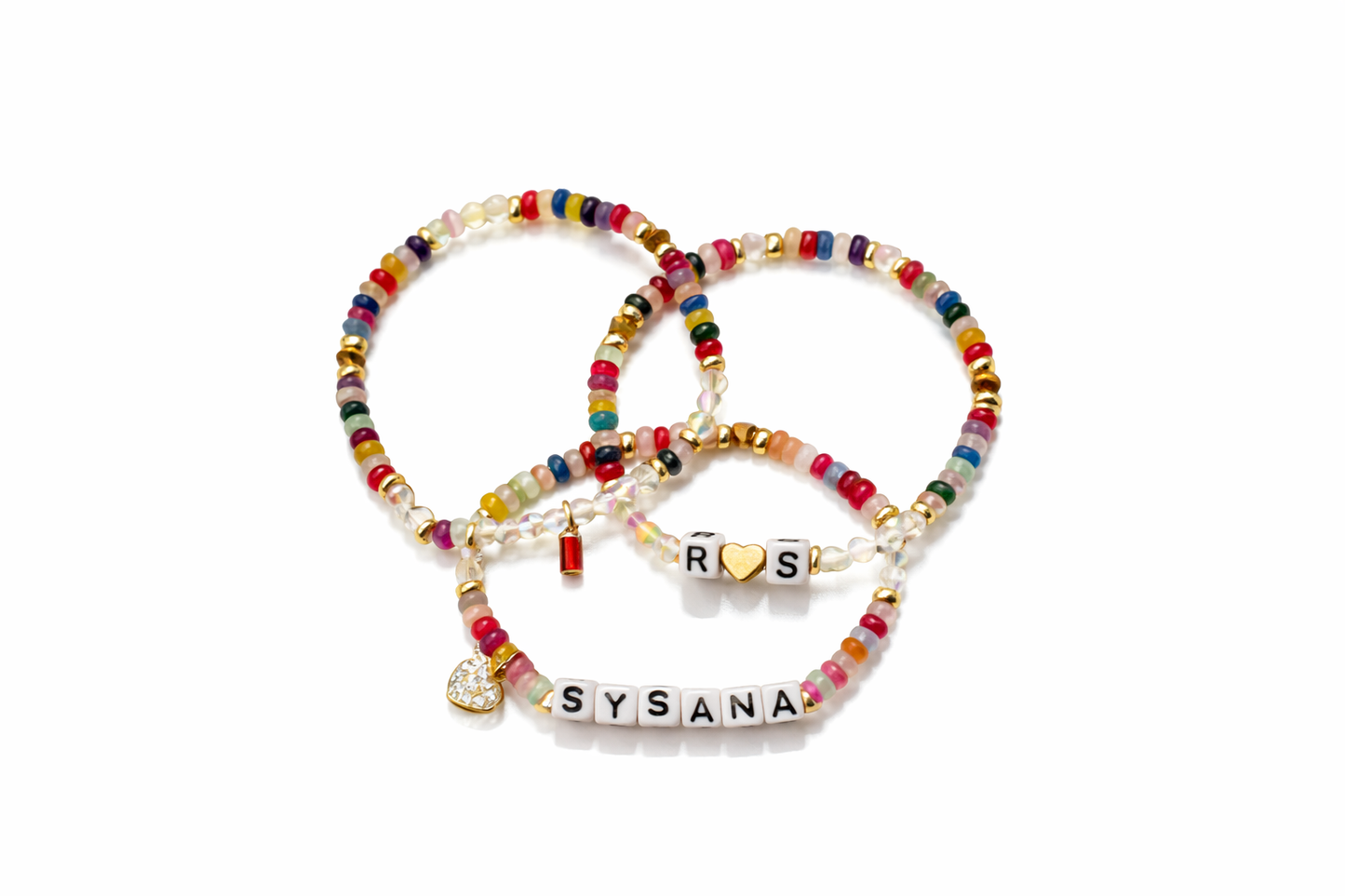 Rainbow Confetti personalized bracelet trio on a white boutique background