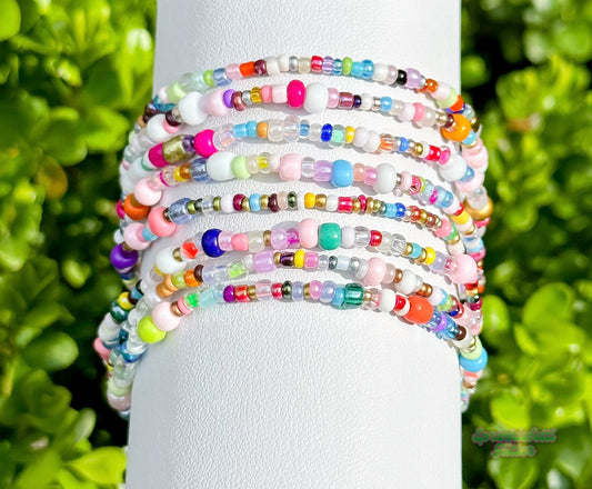Colorful Candy Confetti beaded bracelet stack displayed outdoors