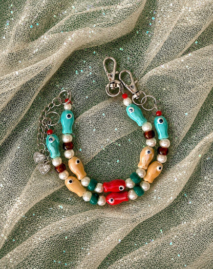 Gone Fishing Socialite double-strand necklace with colorful mystery fish beads, pearls, green accents and silver stainless steel hardware