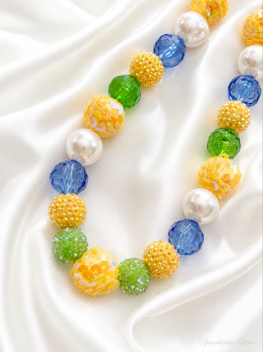 Lemon Parlor statement necklace with yellow, green, blue and pearl beads