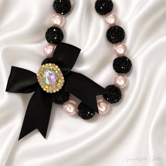 Midnight Blush Heiress Necklace with black beads, blush pearls, and jeweled bow