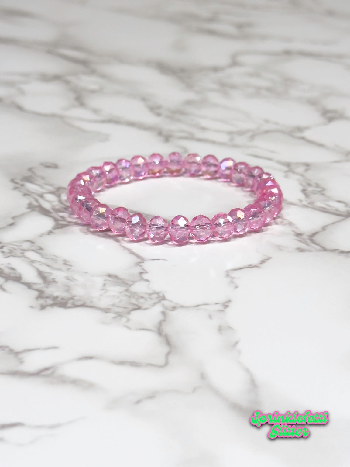 Pink Champagne faceted crystal stretch bracelet on marble
